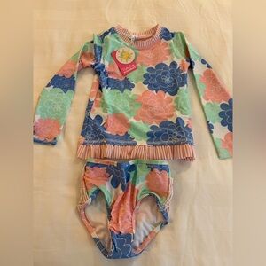 NWT Ruffle Butts long sleeve rash guard. Size 7. Pastel petals color. 2 piece.